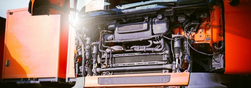A diesel truck opened to reveal its engine
